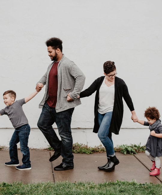 a family holding hand together